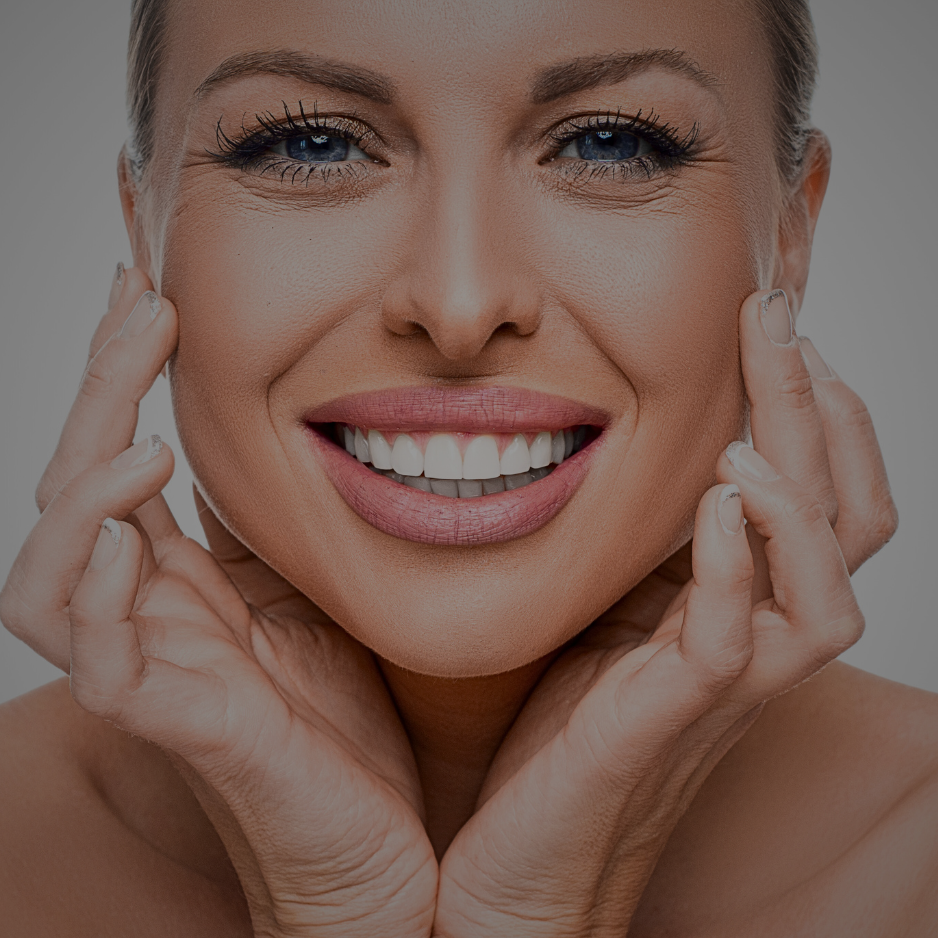 A beautiful model smiling into the camera with a glowing youthful reflection on her face from using our products at Kandilynns.com